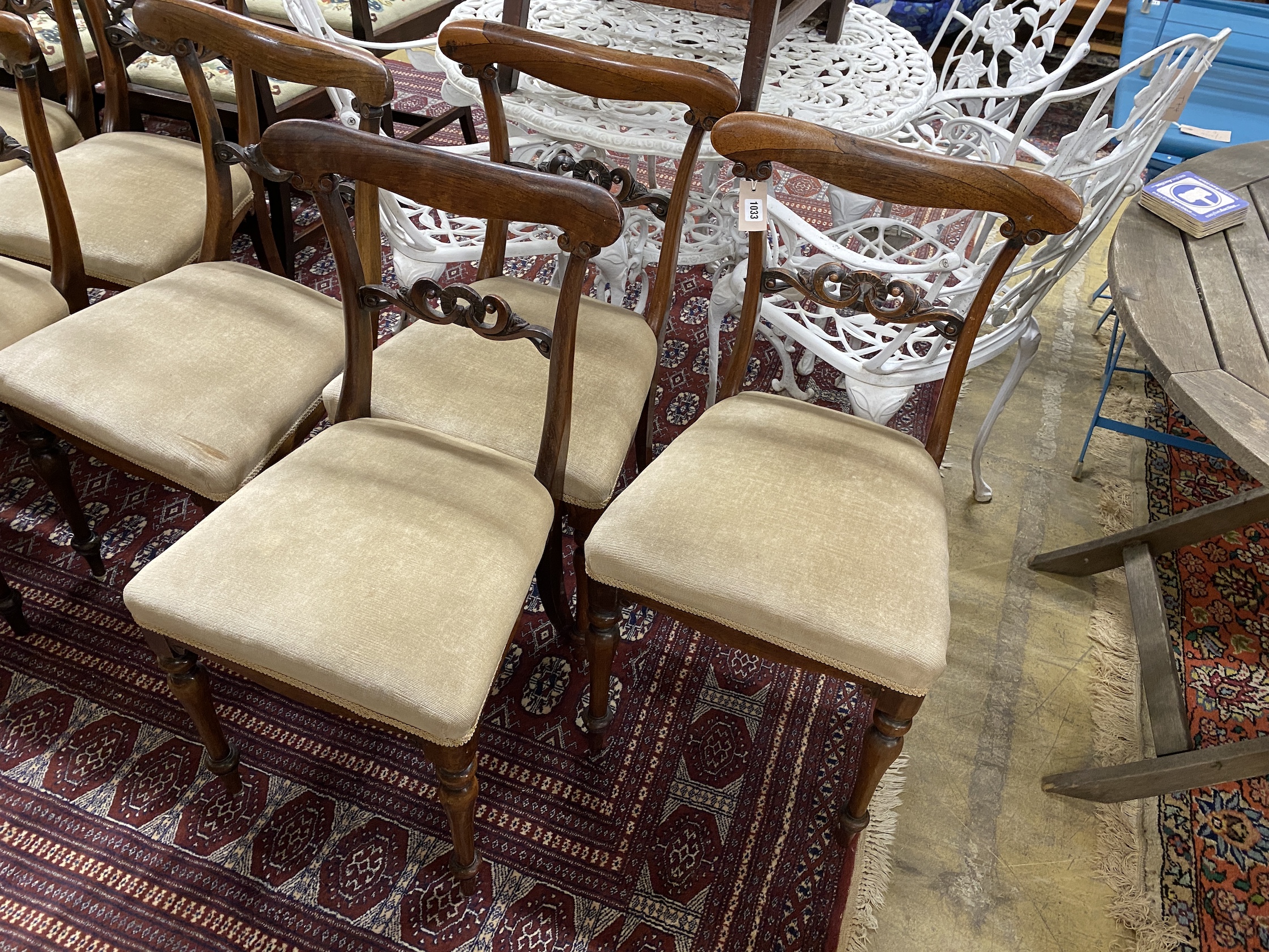 A set of ten early Victorian rosewood dining chairs with upholstered seats, width 44cm, height 82cm